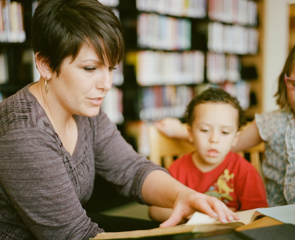Teacher working with student