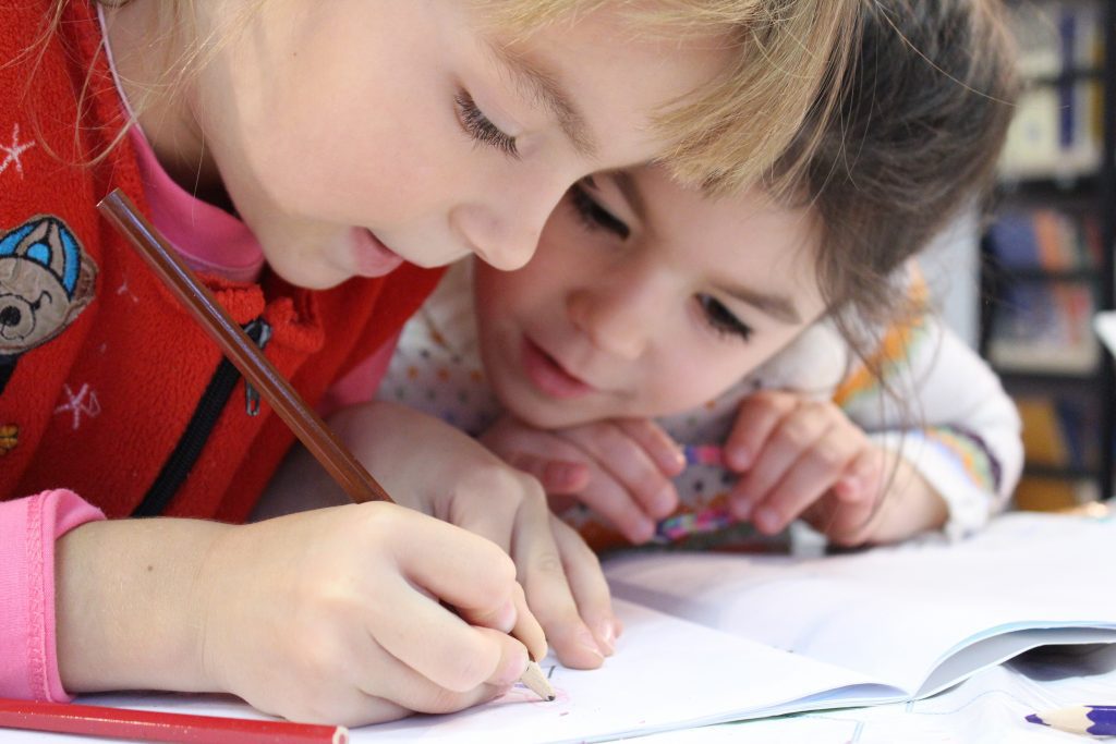 Two students working together in a classroom
