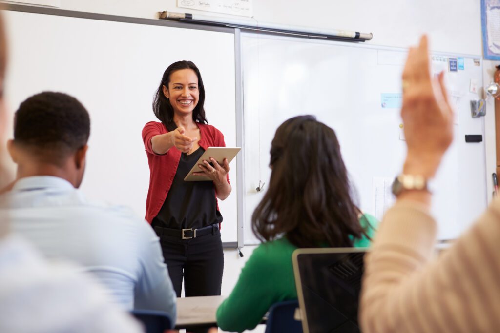 Teacher in front of colleagues using peer observation tool